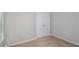 Carpeted bedroom with double door closet, window and neutral colored walls and baseboards at 9569 Sw 62Nd Ct, Ocala, FL 34476