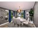 Elegant dining room with gray walls and a modern light fixture at 6013 Sw 96Th Pl, Ocala, FL 34476