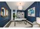 Home office featuring a large desk, built-in shelving, and window at 6013 Sw 96Th Pl, Ocala, FL 34476