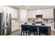 Modern kitchen with stainless steel appliances and white cabinets at 6013 Sw 96Th Pl, Ocala, FL 34476