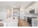 Modern kitchen with stainless steel appliances, gray cabinets and quartz countertops at 6062 Sw 97Th St, Ocala, FL 34476