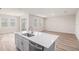 Spacious living room with dining area, stainless steel appliances and modern design at 6062 Sw 97Th St, Ocala, FL 34476