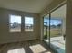 Bright living room features two windows and sliding glass door offering plenty of natural light and views of the outdoors at 6062 Sw 97Th St, Ocala, FL 34476