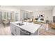 Spacious living room with dining area, stainless steel appliances and modern design at 6062 Sw 97Th St, Ocala, FL 34476
