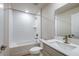 Well-lit bathroom with shower, tub, textured tile, and modern vanity at 6074 Sw 97Th St, Ocala, FL 34476