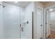 Modern bathroom features sleek glass shower with textured tile and brushed nickel fixtures at 6074 Sw 97Th St, Ocala, FL 34476