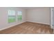 Bright bedroom offers plush carpeting, and windows providing a scenic outdoor view at 6074 Sw 97Th St, Ocala, FL 34476