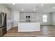 Open kitchen design with center island, stainless steel appliances, and ample cabinet space at 6074 Sw 97Th St, Ocala, FL 34476