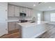 Modern kitchen design featuring stainless steel appliances, center island, and lots of light at 6074 Sw 97Th St, Ocala, FL 34476