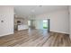 Open-concept living area with bright kitchen, lots of space, and sliding glass door at 6074 Sw 97Th St, Ocala, FL 34476