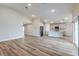 Bright and airy open-concept living space with wood floors and modern kitchen at 6074 Sw 97Th St, Ocala, FL 34476