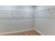 Walk-in closet features a built-in shelving system for optimized storage and organization at 6074 Sw 97Th St, Ocala, FL 34476