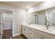 Bathroom with double vanity, spacious mirrors, and modern fixtures at 6218 Sw 95Th Pl, Ocala, FL 34476