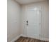 Entryway featuring a white door and modern digital lock at 6218 Sw 95Th Pl, Ocala, FL 34476