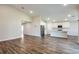 Bright and airy living room and kitchen area with modern appliances and wood flooring at 6218 Sw 95Th Pl, Ocala, FL 34476