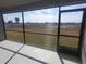 An outdoor, screened in patio with views of the community's lawn at 6218 Sw 95Th Pl, Ocala, FL 34476