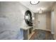 Elegant entryway with a large mirror and stylish console table at 6243 Sw 97Th St, Ocala, FL 34476