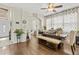 Spacious dining room features a rustic wooden table and decorative curtains for a cozy atmosphere at 2644 W 75Th Blvd, Bushnell, FL 33513