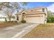 Charming two-story home with an attached two-car garage and a well-manicured front yard at 2644 W 75Th Blvd, Bushnell, FL 33513