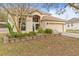 Charming two-story home with an attached two-car garage and a well-manicured front yard at 2644 W 75Th Blvd, Bushnell, FL 33513