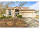 Charming two-story home with an attached two-car garage and a well-manicured front yard at 2644 W 75Th Blvd, Bushnell, FL 33513