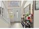 Bright foyer with ceramic tile and staircase, complemented by decorative accents and neutral walls at 2644 W 75Th Blvd, Bushnell, FL 33513