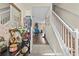 Welcoming foyer with hardwood floors and a staircase, complemented by decorative accents and neutral walls at 2644 W 75Th Blvd, Bushnell, FL 33513