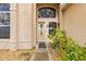 Inviting home entrance featuring decorative landscaping and a well-lit doorway at 2644 W 75Th Blvd, Bushnell, FL 33513