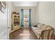 Inviting living room with large window, vintage furnishings, and great natural light at 2644 W 75Th Blvd, Bushnell, FL 33513