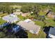 Charming single-story home features well-manicured lawn, mature trees, and convenient covered parking at 1019 Milner E Dr, Lakeland, FL 33810