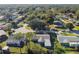 This aerial perspective highlights a single-story home with lush landscaping and convenient parking at 1019 Milner E Dr, Lakeland, FL 33810