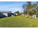 Sprawling backyard with playset, shed, and ample green space at 1019 Milner E Dr, Lakeland, FL 33810