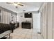 Bright bedroom with tile floors, fan, large mirror and vanity with bright lights at 1019 Milner E Dr, Lakeland, FL 33810