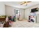 Bedroom featuring tile floors and a ceiling fan at 1019 Milner E Dr, Lakeland, FL 33810