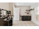 Bedroom featuring tile floors and a light filled mirror at 1019 Milner E Dr, Lakeland, FL 33810