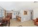 Dining area with a wooden table and chairs, leading to the kitchen at 1284 Vanderbilt Dr, Ormond Beach, FL 32174