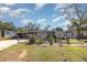 Gray house with a wooden fence and landscaped yard at 1284 Vanderbilt Dr, Ormond Beach, FL 32174