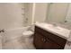 Bathroom with shower, toilet, and vanity with dark brown cabinets at 2986 Greenhill Way, Saint Cloud, FL 34772