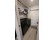 Laundry room with washer, dryer, and shelving at 1524 Fleur Dr, Davenport, FL 33837