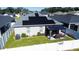 Backyard featuring solar panels, enclosed patio space, privacy fence, and well-maintained landscaping at 6855 Mossy Oak Ln, Lakeland, FL 33810