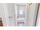 Neutral bath with tub/shower combination and tile surround, accessible from hallway at 6855 Mossy Oak Ln, Lakeland, FL 33810