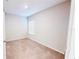 Bedroom showcasing a single window, neutral walls, and neutral carpet at 6855 Mossy Oak Ln, Lakeland, FL 33810