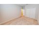 Well-lit bedroom featuring a plush carpet, and closet for storage at 6855 Mossy Oak Ln, Lakeland, FL 33810