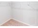 Spacious walk-in closet with wall-mounted metal shelving for easy organization and ample storage at 6855 Mossy Oak Ln, Lakeland, FL 33810