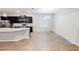 Open kitchen featuring stainless steel appliances, ample counter space, and a dining area with natural light at 6855 Mossy Oak Ln, Lakeland, FL 33810