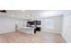 Bright kitchen with a large island, stylish pendant lights, and stainless steel appliances at 6855 Mossy Oak Ln, Lakeland, FL 33810