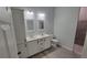 Double vanity bathroom with gray tile shower and flooring at 13898 Sw 32Nd Ter, Ocala, FL 34473