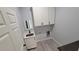 Laundry room with built-in cabinets and a utility sink at 13898 Sw 32Nd Ter, Ocala, FL 34473