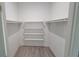 Bright walk-in closet with shelves and hanging rods at 13898 Sw 32Nd Ter, Ocala, FL 34473