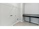 Well-lit laundry area with countertop and tile flooring at 3007 Mirage Pl, Saint Cloud, FL 34771